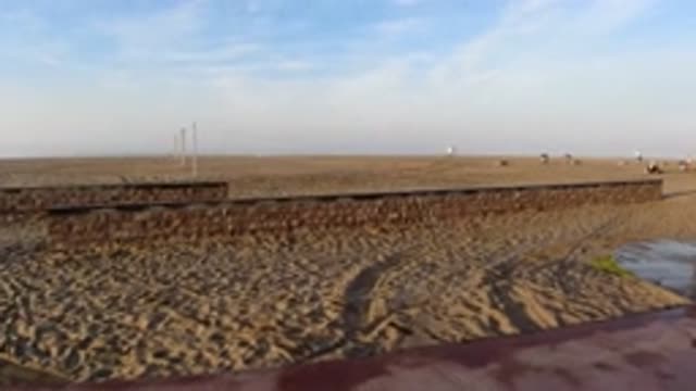 HUNTINGTON BEACH CALIFORNIA-2019: Stroll Sidewalk Viewing Empty Beach Full Sand