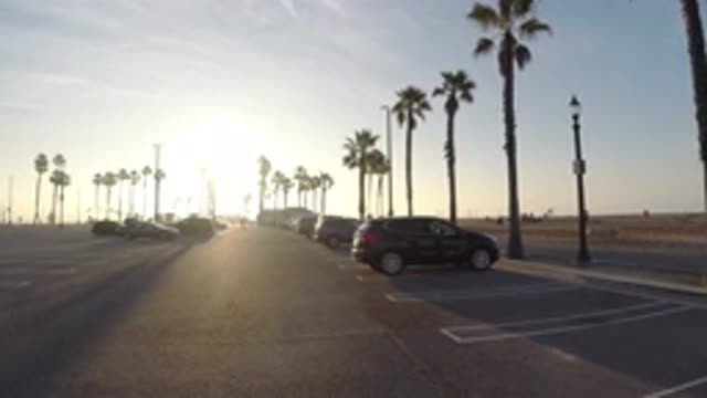 HUNTINGTON BEACH CALIFORNIA-2019: Person Walking In A Parking Lot In The Early Morning