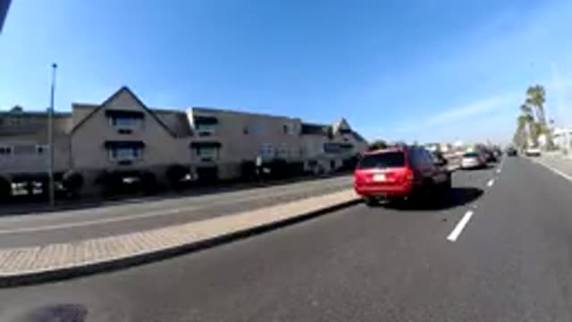 HUNTINGTON BEACH CALIFORNIA-2019: A Time Lapse Of A Car Going Down The Road And