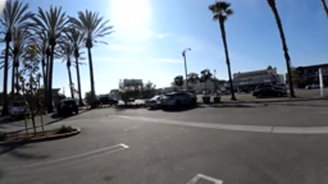 HUNTINGTON BEACH CALIFORNIA-2019: Cars Stopped And Passing In The Parking Lot