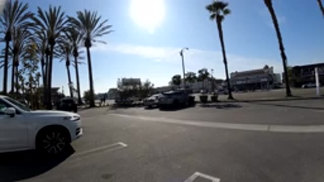 HUNTINGTON BEACH CALIFORNIA-2019: View From A Parking Lot Of Cars Moving Quickly