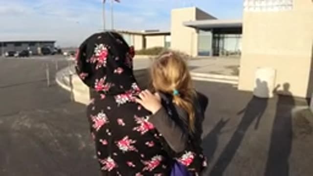BOLSA CHICA CALIFORNIA-2019: Mom Carrying Her Daughter Inside A Building