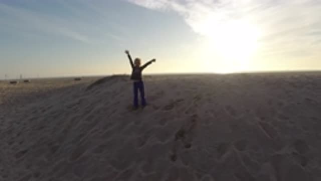BOLSA CHICA CALIFORNIA-2019: Person With Open Arms Standing On Sand Dunes In
