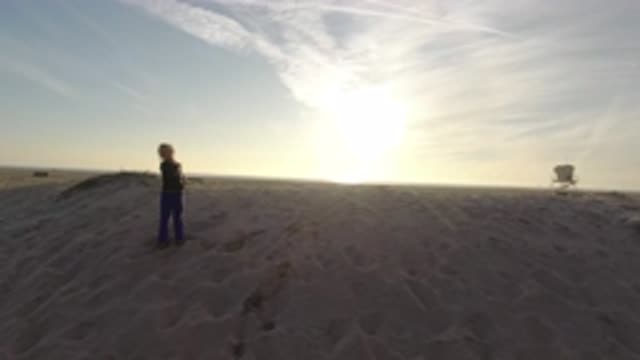 BOLSA CHICA CALIFORNIA-2019: Happy Girl Dancing With A Golden Sunset At The Beach