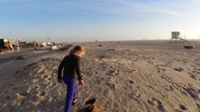 BOLSA CHICA CALIFORNIA-2019: Girl Walking On The Beach In The Sand