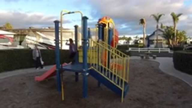 PISMO BEACH CALIFORNIA-2019: Kids Playing At A Park Under Adult Supervision In