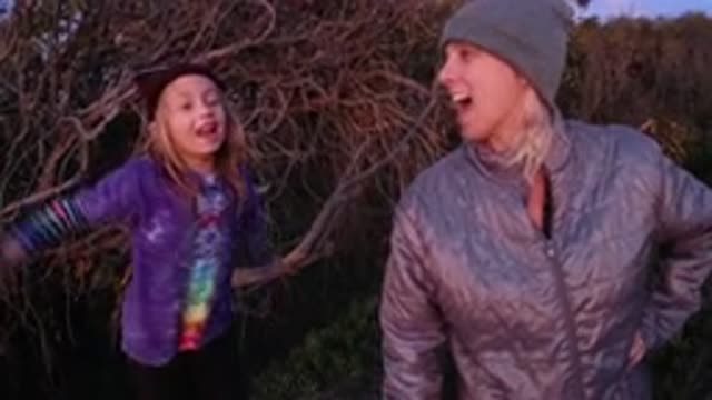 PISMO BEACH CALIFORNIA-2019: A Mother And Her Child Are Outside Talking About