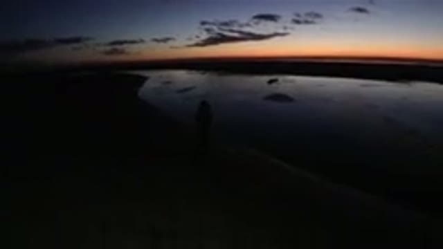 PISMO BEACH CALIFORNIA-2019: Silhouette Of Woman Standing On Beach At Sunset