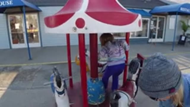 PISMO BEACH CALIFORNIA-2019: Zealous Mother Takes Care Of Daughter Who Is Playing