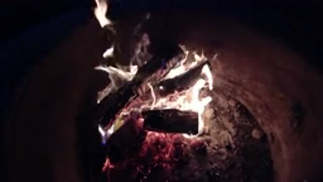 PISMO BEACH CALIFORNIA-2019: Logs Peaked in Fire Pit with Flames Burning in Slow Motion