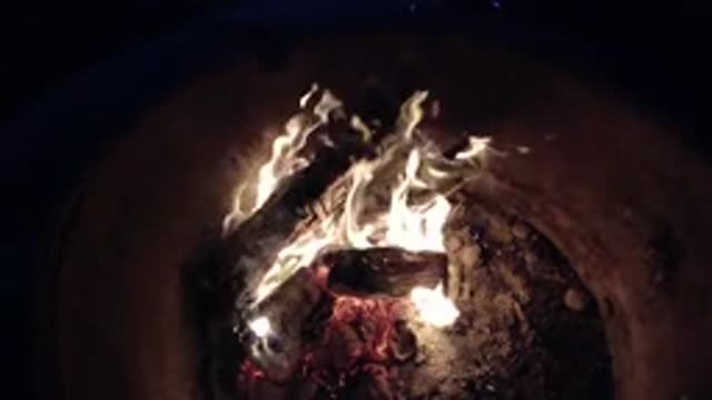 PISMO BEACH CALIFORNIA-2019: Fire Burning In Dark Grey Pit On A Clear Evening