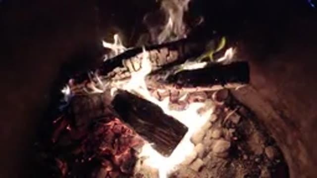 PISMO BEACH CALIFORNIA-2019: Logs Burning With A Warm Orange Flame Among A Bed