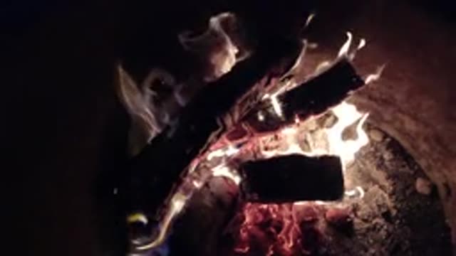PISMO BEACH CALIFORNIA-2019: A Pile Of Logs Burning In A Fire Pit At Night