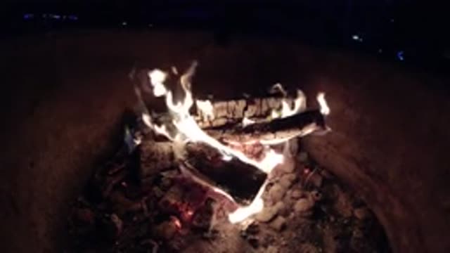 PISMO BEACH CALIFORNIA-2019: Flames Rise From Burning Wood In A Fire Pit At Night