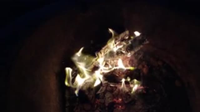 PISMO BEACH CALIFORNIA-2019: Flame Flaring Up From A Fire Burning Wood Steadily