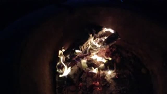 PISMO BEACH CALIFORNIA-2019: Wood In A Deep Container Burning And Turning Into Coals