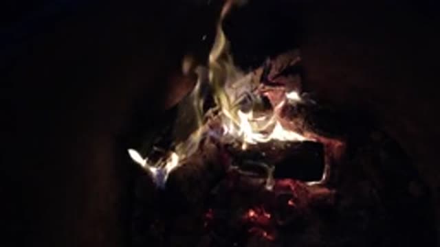 PISMO BEACH CALIFORNIA-2019: A Campfire Burning On A Continuous Loop Of A Video