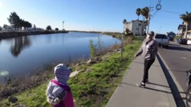 PISMO BEACH CALIFORNIA-2019: Woman And Child Enjoy Coffee Near Blue Water