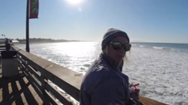 PISMO BEACH CALIFORNIA-2019: Couple Enjoying The Sunset On A Platform Near The