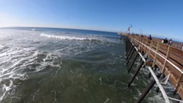 PISMO BEACH CALIFORNIA-2019: The Ocean And A Pier On A Clear Day With Blue Skies