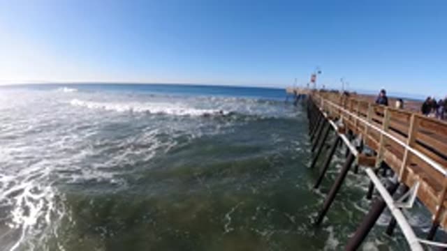 PISMO BEACH CALIFORNIA-2019: People Strolling On The Pier Watching The Waves