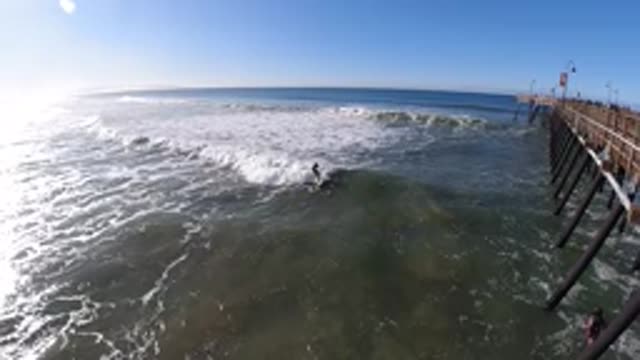 PISMO BEACH CALIFORNIA-2019: Expansive Body Of Water With A Single Person Riding