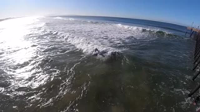 PISMO BEACH CALIFORNIA-2019: Large Waves Move By Quay In Slow Motion