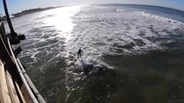 PISMO BEACH CALIFORNIA-2019: Man Surfing On A Sunny Day In Good Waves