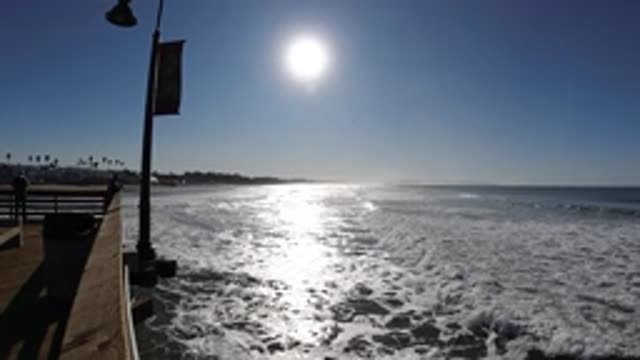 PISMO BEACH CALIFORNIA-2019: View Near End Of Pier Waves Roll In Slow Motion