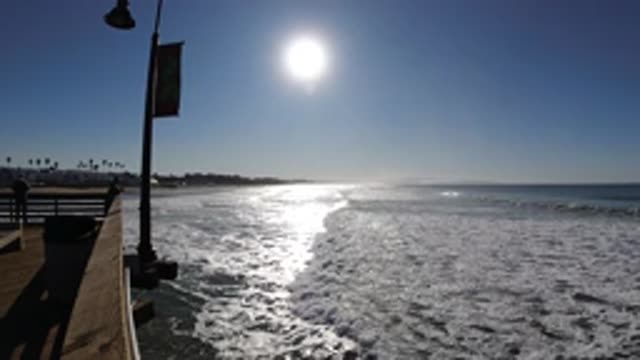 PISMO BEACH CALIFORNIA-2019: The Waves Are Slowly Kissing The Sandy Shore Of The