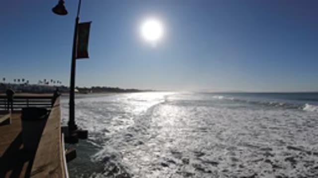 PISMO BEACH CALIFORNIA-2019: Slow Motion Foam Covered Waves Crashing On Beach