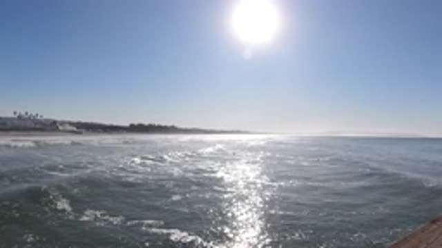 PISMO BEACH CALIFORNIA-2019: Watching The Ocean On A Beautiful Sunny Day From A Pier