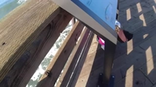 PISMO BEACH CALIFORNIA-2019: Bearded Man Wearing Sunglasses Filming Himself at the Pier