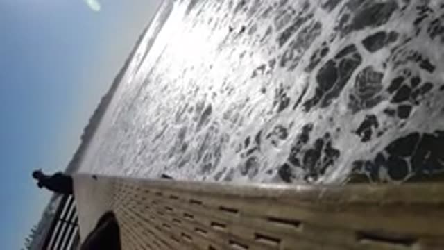 PISMO BEACH CALIFORNIA-2019: People At A Dock With Water Lapping Against The