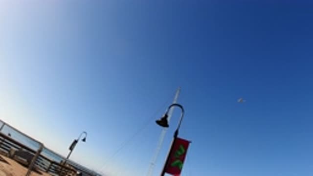 PISMO BEACH CALIFORNIA-2019: Clear Blue Sky On The Pier Next To The Water