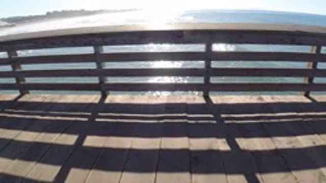 PISMO BEACH CALIFORNIA-2019: Moving Along Pier Next To The Ocean Near A Beach In