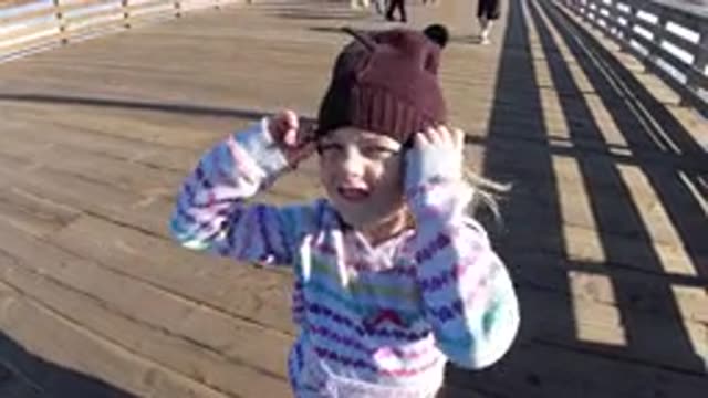 PISMO BEACH CALIFORNIA-2019: A Little Cute Girl Wearing Her Brown Hat On Her