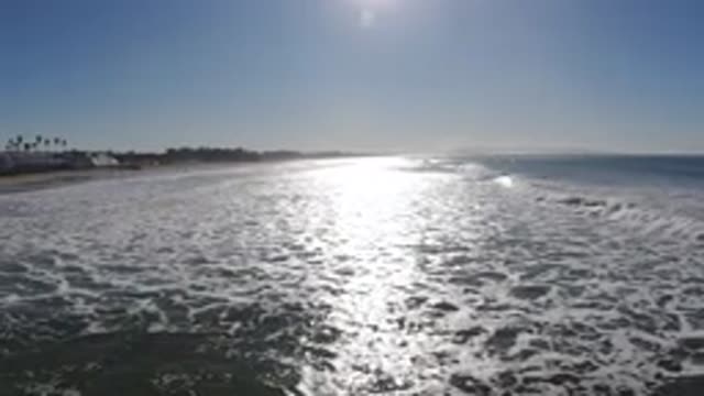 PISMO BEACH CALIFORNIA-2019: Ocean Waves And Surf Wash Ashore On A Beach As The