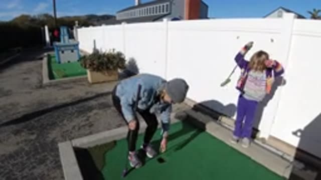 PISMO BEACH CALIFORNIA-2019: Mom And Daughter Play Flamingo Together And