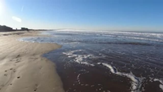 PISMO BEACH CALIFORNIA-2019: Quiet Walk On The Beach Sand At Dawn Watching The Waves