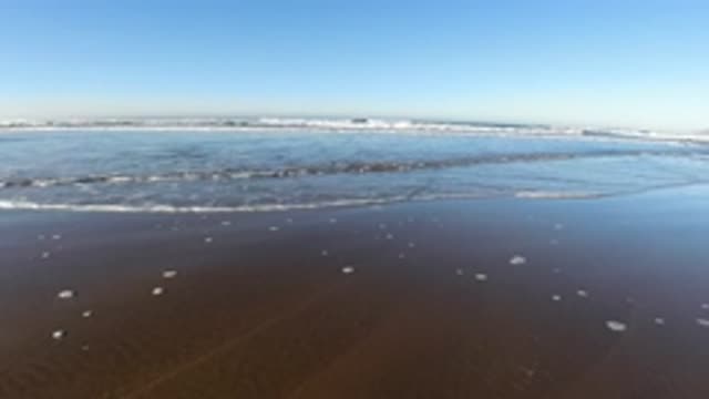 PISMO BEACH CALIFORNIA-2019: Calm Sea In A Blue Sky