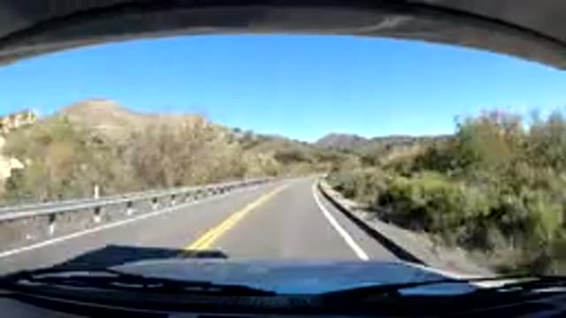 CENTRAL COAST CALIFORNIA-2019: A Time Lapse Of A Car Going Down A Road Where