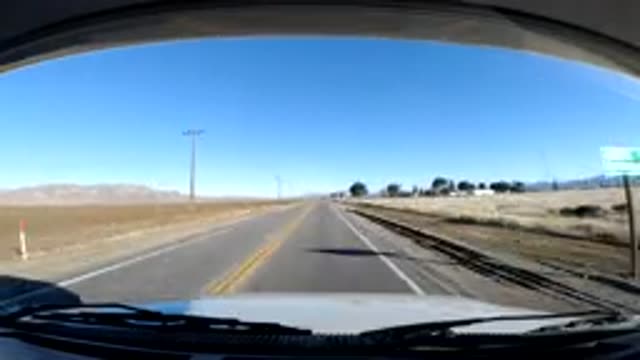 CENTRAL COAST CALIFORNIA-2019: Sped Up Dashboard Camera Car Driving Along Desert