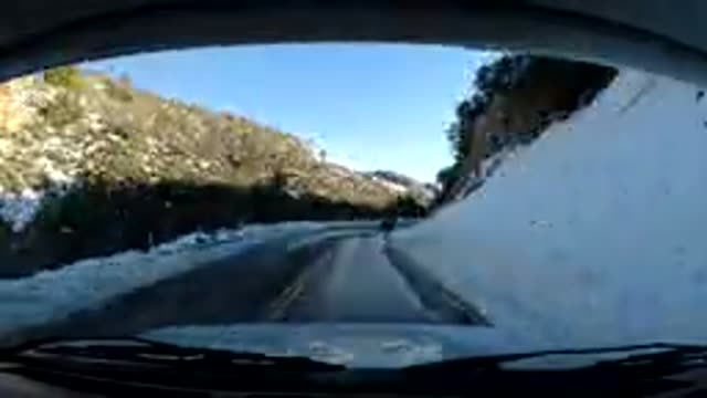 CENTRAL COAST CALIFORNIA-2019: Vehicle Moves Along Winding Mountain Road Film