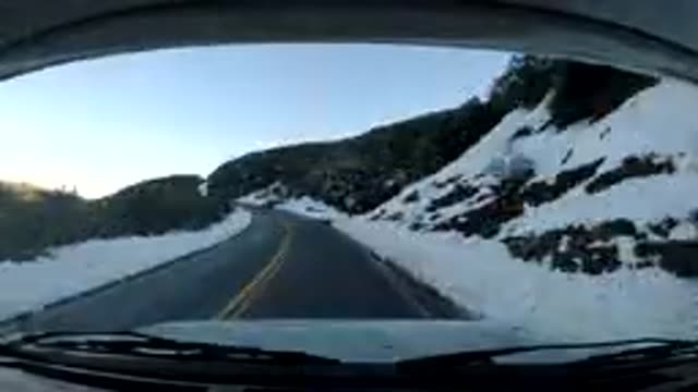 CENTRAL COAST CALIFORNIA-2019: Seeded Up Film Of Car Traveling Up The Side Of A Mountainside