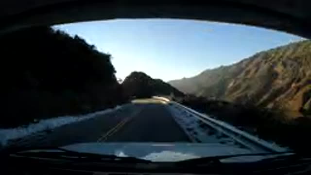 CENTRAL COAST CALIFORNIA-2019: Car Driving Along A Highway Surrounded By Hills