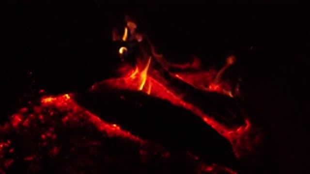 OJAI CALIFORNIA-2019: A Bonfire With Woods Burning In Slow Motion With Black