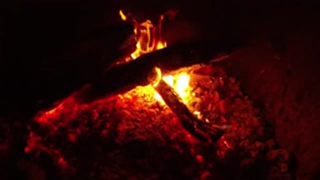 OJAI CALIFORNIA-2019: Outdoor Campfire Burning At Nighttime With Wooden Logs At