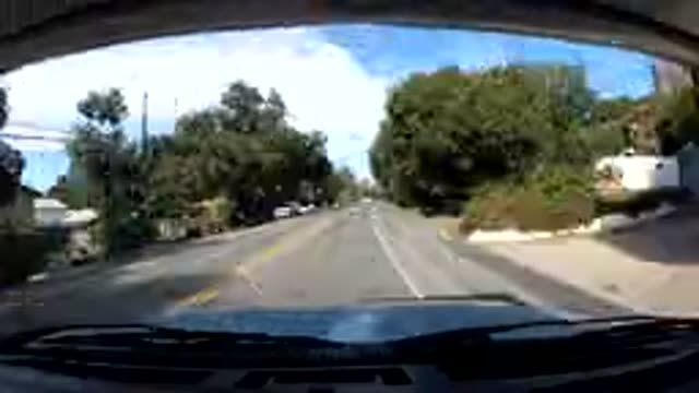 OJAI CALIFORNIA-2019: Trees Hills Road And People From Inside A Fast Moving Vehicle