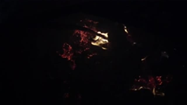 OJAI CALIFORNIA-2019: Logs Burning In A Campfire At Night